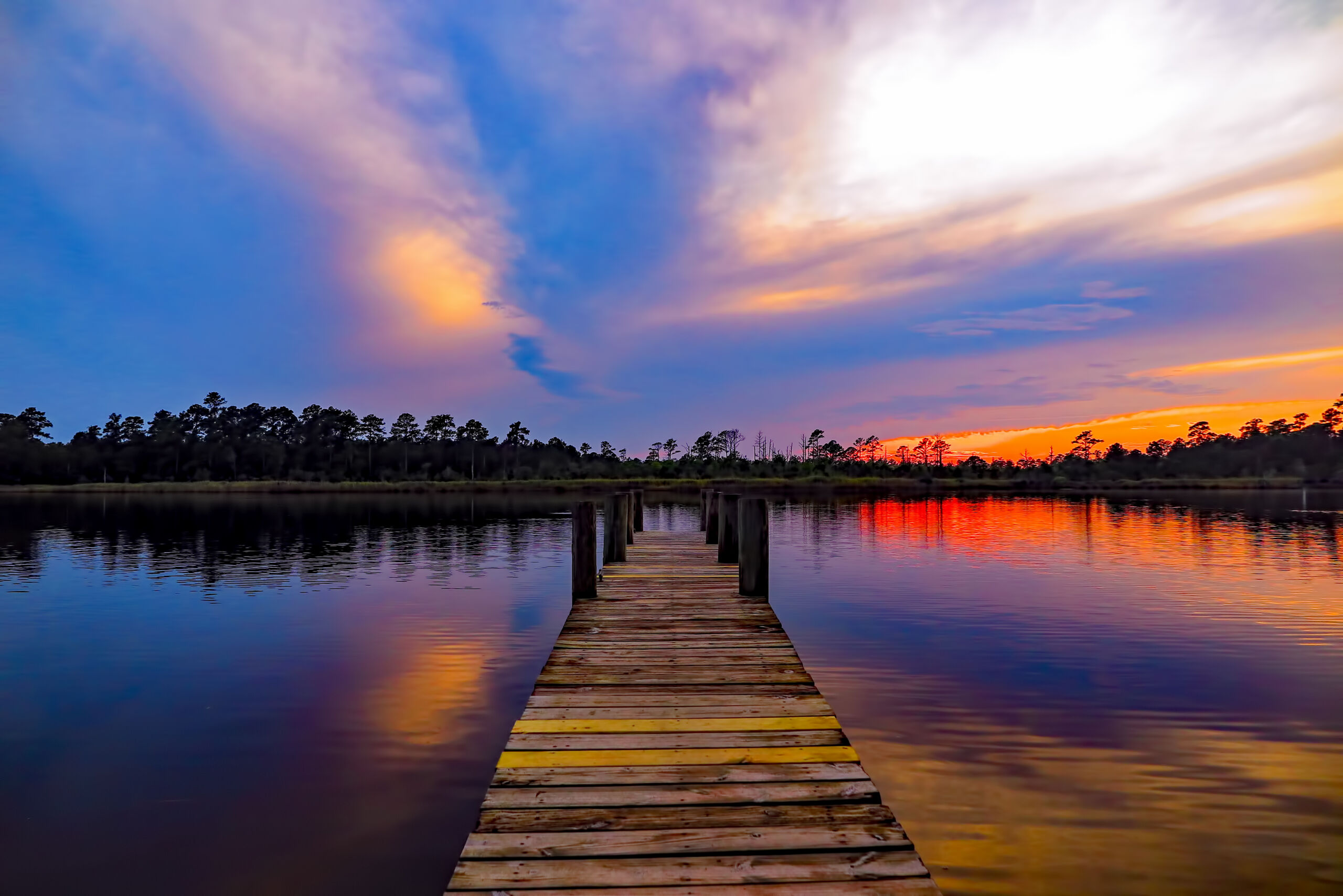 What If Book – Possibility Dock Wooden dock leading into a lake beneath a colorful sky
